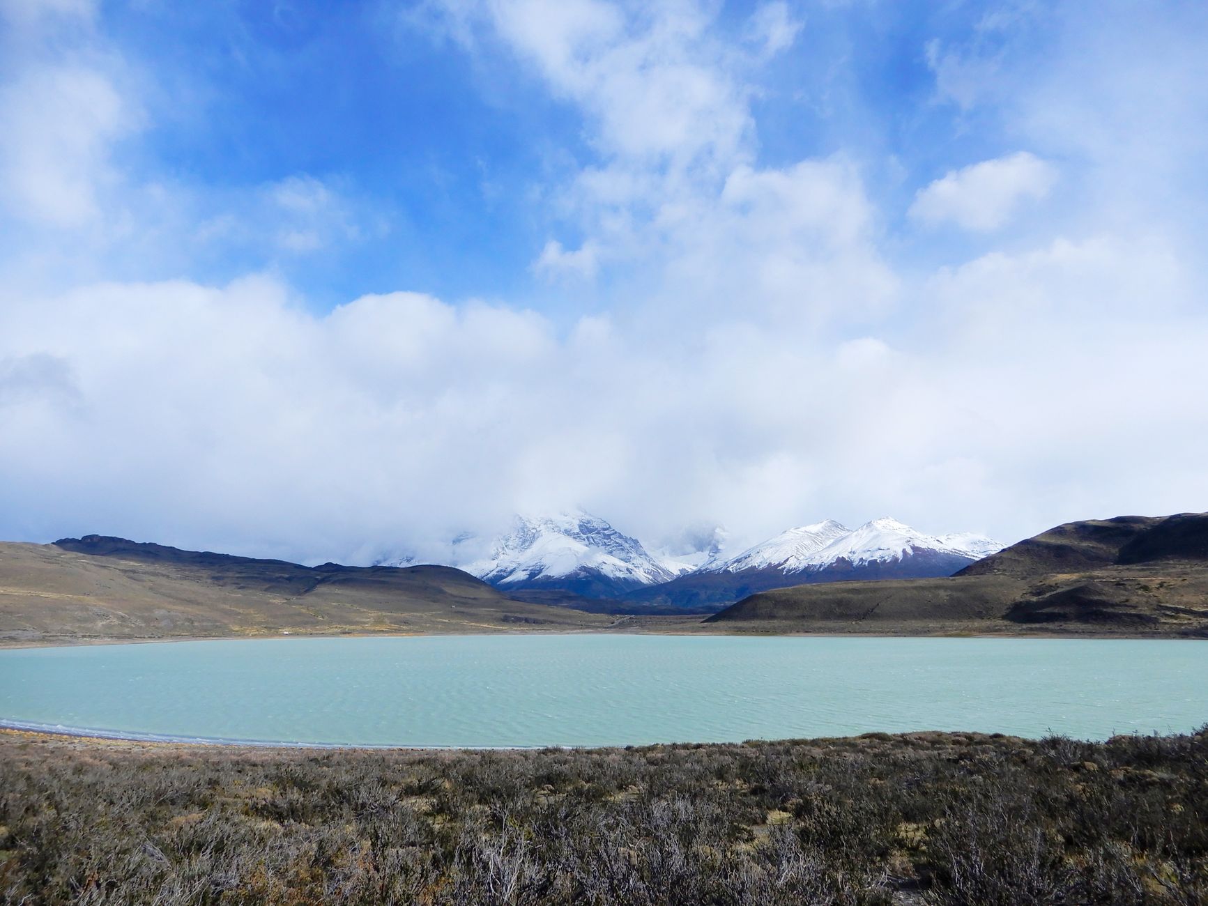 Patagonian mountain ridge reflecting in calm glacial lake